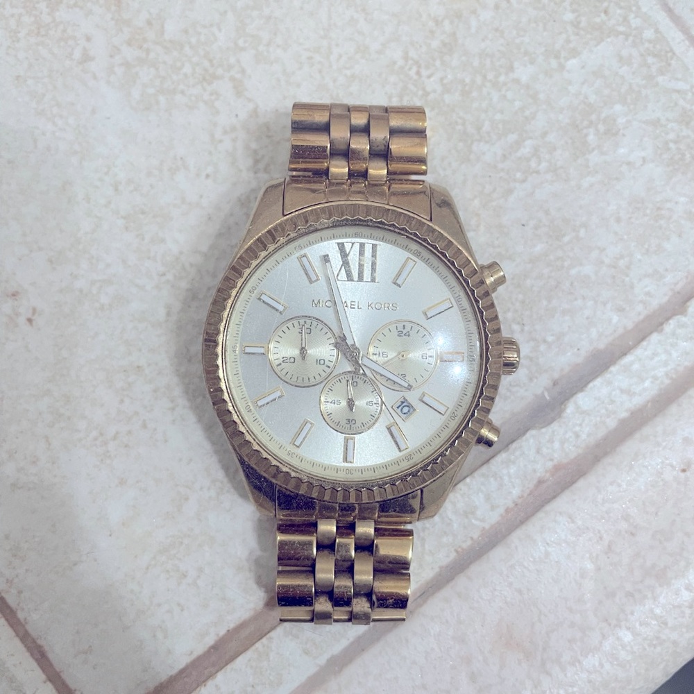 Micheal Kors gold watch.